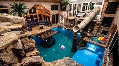 Pic credit: Swimply/ Mandy An Indiana man sketched a backyard pool on a napkin after a 1.5-year installation wait; two years later it became a 60,000-gallon private water park now renting for $140 an hour