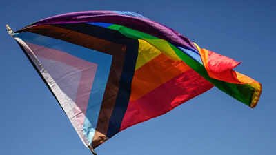 File photo: - A pride flag is held during an LGBTQ+ Pride March In SC, biological women oppose equal rights for transgender women