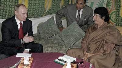 Vladimir Putin with Muammar Gaddafi (Photo source: Wiki Commons under creative commons license) The backstory: When West 'tricked' Russia to overthrow Muammar Gaddafi's regime in Libya