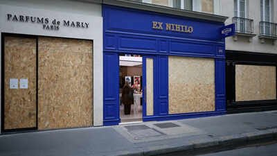 View of shops with display windows protected by wooden panels days ahead of a second round of demonstrations in Paris, France Watch: Paris shops increase security, board up windows, as France braces for weekend protests
